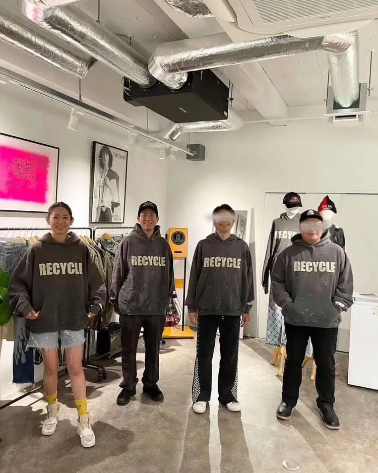 GALLERY DEPT. 90'S RECYCLE HOODIE WASHED BLACK 90'S washed hoodie with distressed eco-friendly slogans. Washed black S-XL. Ready-made garments are washed and dyed again. Multiple spots throughout the body are spray-faded. The ribs are cut and worn.